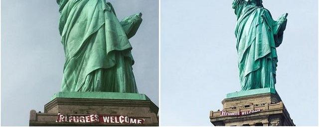 В США неизвестные повесили на статую Свободы баннер в поддержку беженцев