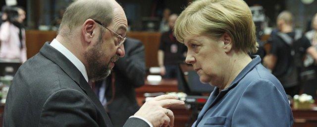 Опрос: За месяц до выборов союз Меркель опережает конкурентов