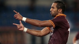 AS Roma's Benatia celebrates after scoring againstBologna during their Italian Serie A soccer match at the Olympic stadium in Rome