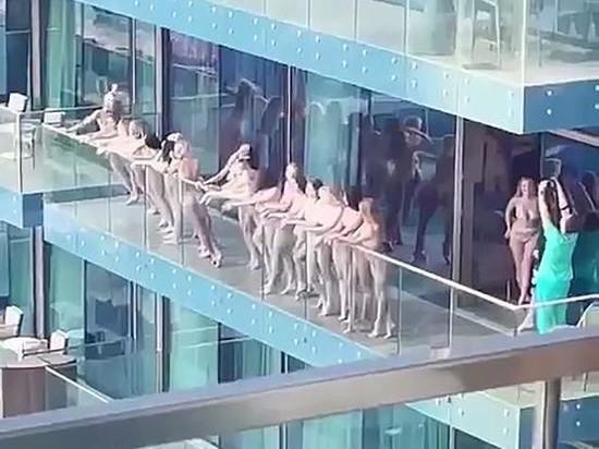 В Дубае из-за обнаженной фотосессии на балконе небоскреба арестовали 10 девушек - Видео