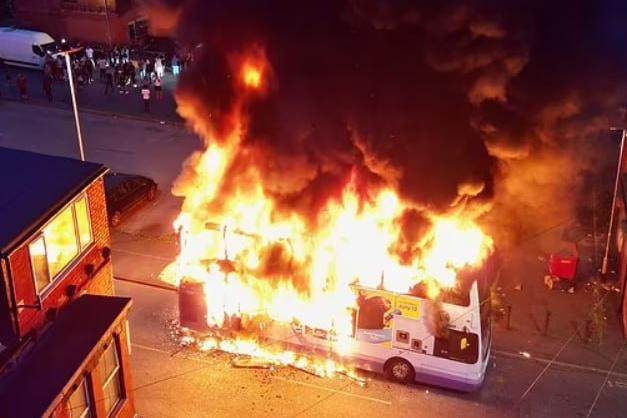 Unknown people set fire to a bus and overturned a police car in Leeds