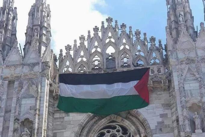 A large Palestinian flag is hung in Milan