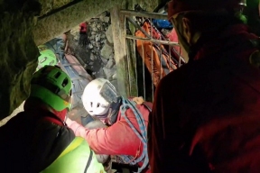 A caving enthusiast was rescued in Italy after falling into a crevasse for four days