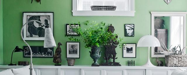 Для поднятия настроения оформите стены гостиной в зеленом цвете