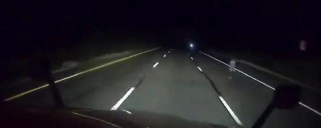 Truck driver captures mysterious ghostly figure standing on side of highway at night