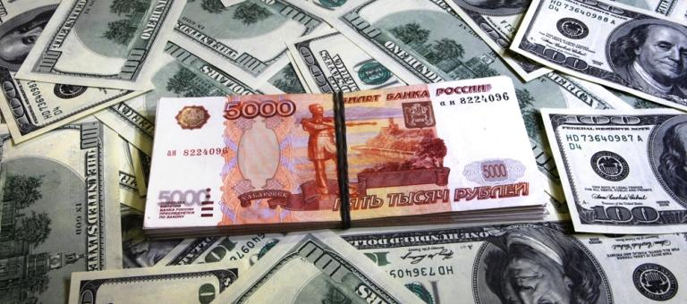 Банк России повысил курс доллара до 65 рублей