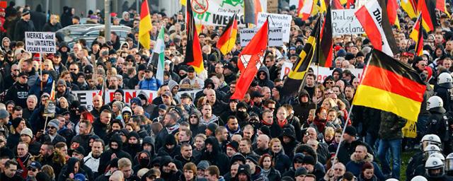 A rift grows between East and West Germany over the authorities' sanctions policy