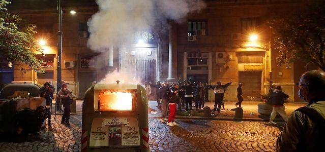In Naples, protesters against COVID restrictions threw smoke bombs at police