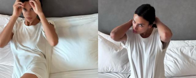 Irina Shayk made a photo shoot in bed in a T-shirt and shoes